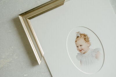 Gold frame corner by a matted heirloom print