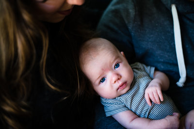 blue eyed newborn in grey stripes