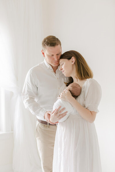 gorgeous image of new parents during their newborn photography session in Omaha Ne