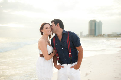 Husband kissing wife in Panama City Beach Florida