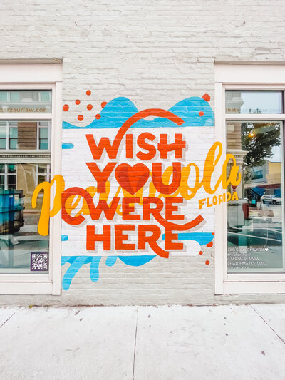 Wish You Were Here Mural in Pensacola FL off Palafox St