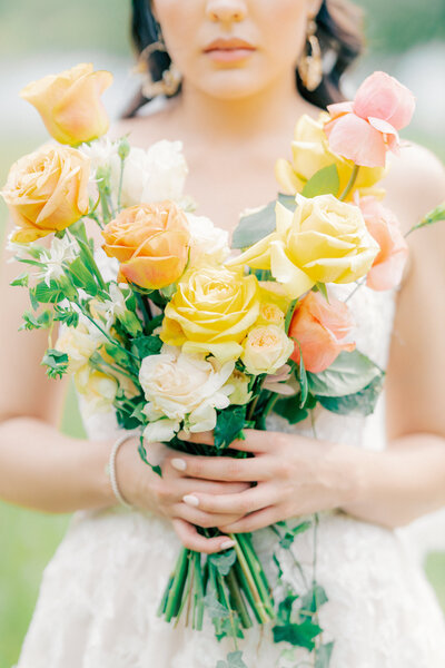 bride holding flowers