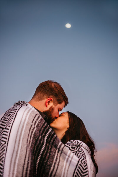 A romantic kiss in the evening under the moon in Northern Colorado