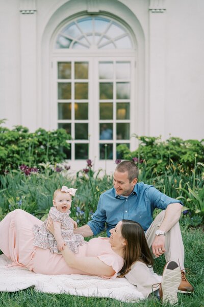 parents playing with their baby girl