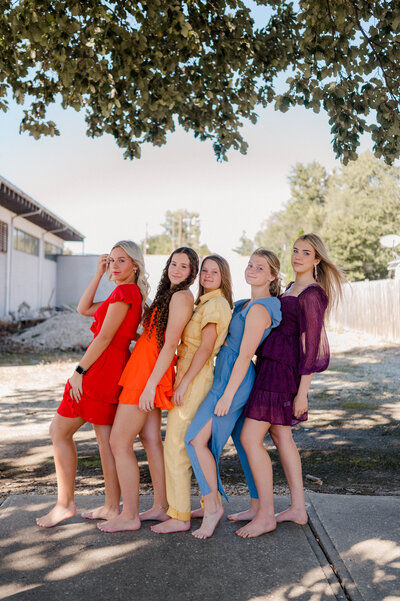 Rachel B Photography's Senior Rep Team poses for the camera in their color block of the rainbow.