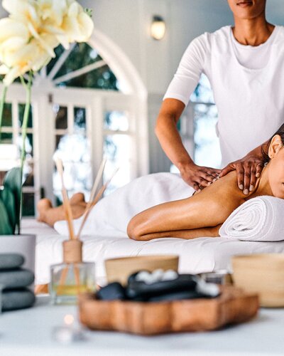 Woman getting a massage at a luxury spa