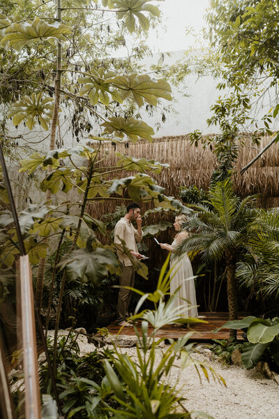 couple exchanging vows in tulum mexico jungle