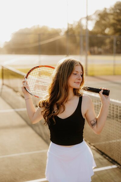 outdoor senior session on the tennis courts in NEW country club