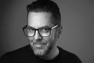 Professional portrait of Rodrigo Varela, a Miami, Florida-based wedding and engagement photographer known for capturing elegant and timeless moments.