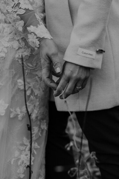 Two brides hold hands during their Colorado elopement