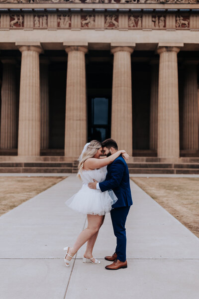 Nashville Elopement Photographer captures couple hugging at Parthenon