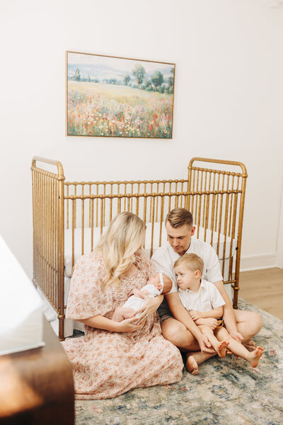 couple in a studio in Houston Texas for their maternity photos
