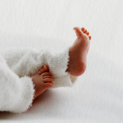 Precious details of newborn captured in studio at Ashtyn Kohler Photography in Olympia, Washington. Capture the most meaningful milestones of your parenthood journey with three Tender Moments sessions.