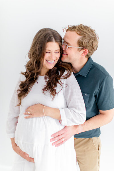 pregnant mom with kids and husband in raleigh studio