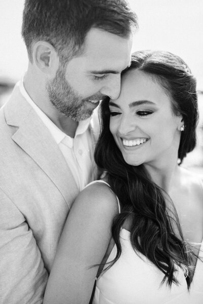 Bride and Groom on a yacht by the ocean