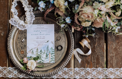 details with bridal bouquet rings boutonniere and wedding invitation 