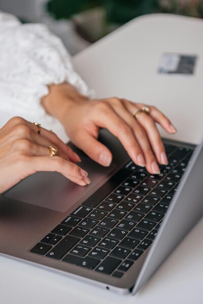 Woman typing on a computer