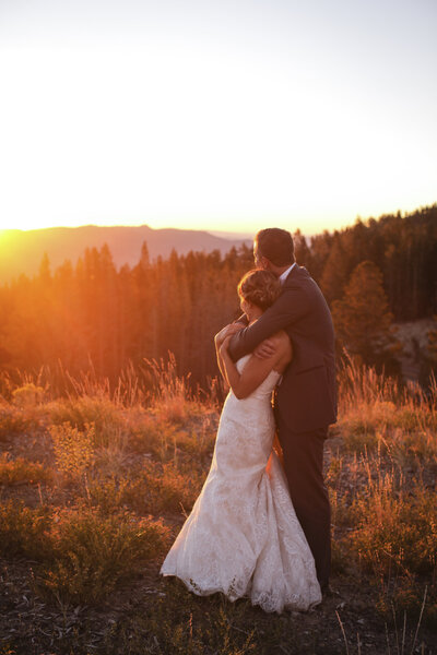 Bride and groom in field