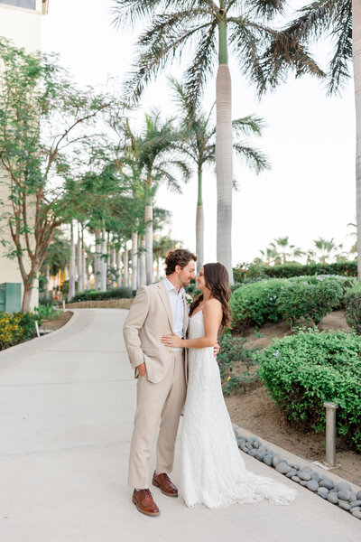 bride and groom looking at each other on a path by Fort myers wedding photographer