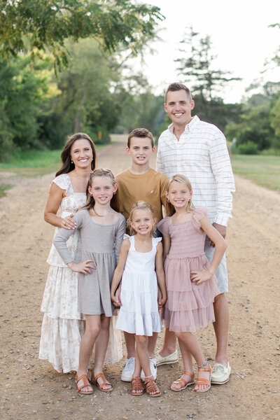 Laura with her family cuddling all together.