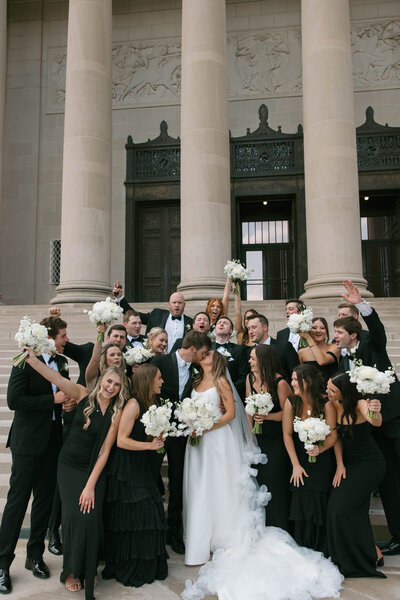 golden hour sunset engagement photos with white dress on bride and black shirt on groom. wedding ring inspiration and windy hair