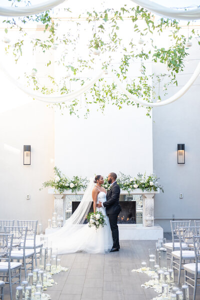 soho63-chandler-wedding-venue-bride-and-groom-outdoor-ceremony-greenery-and-drapery