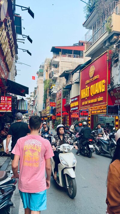 Child walking a crowded Vietnamese street — growing up expat in multicultural cities featured on the Parenting Abroad blog