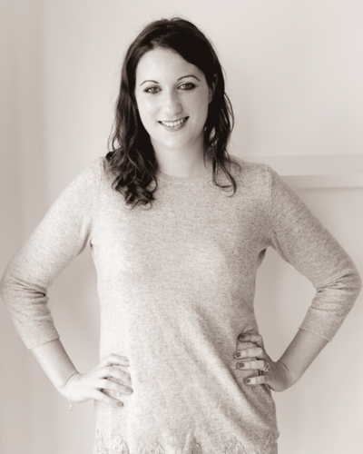 Black and white photo of a brunette woman smiling