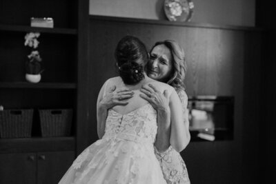 The bride and her mom sharing an emotional hug before the bride's wedding at St. Stefan Serbian Orthodox Church, Ottawa.