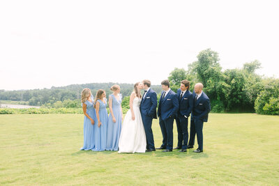 Couple holding hands as the bride looks back at the camera during an Engagement Session