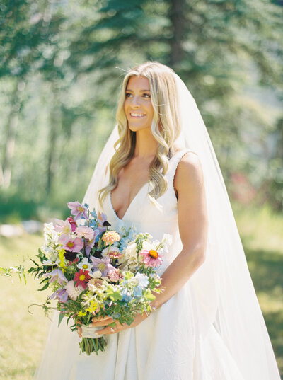 Bride with flowers at Colorado wedding