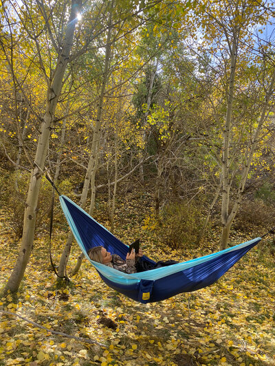 Britt Reading Kindle in Hammock