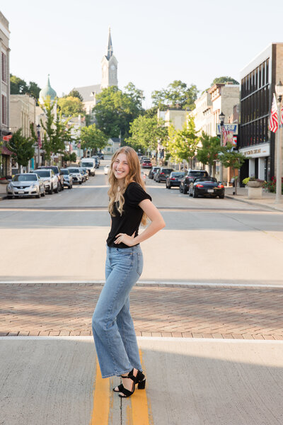 Senior girl seated in front of the camera and smiling