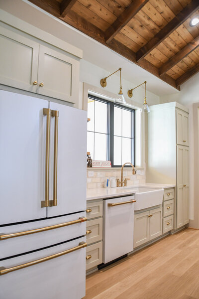Modern farmhouse kitchen, custom home build. Custom tilework, brick backsplash, hardwood flooring and mushroom cabinery.