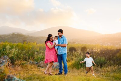 Family walking on a trail taken by Loni Brooke Photography, a Temecula photographer