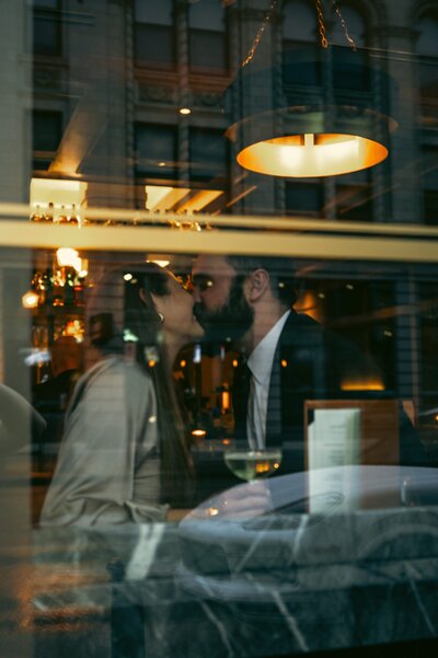 engagement photo take through a window