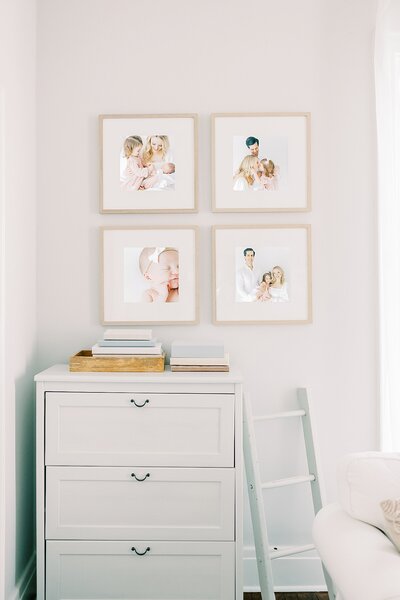An array of picture frames adorning a wall, captured by a portrait photographer in Charlotte, NC.