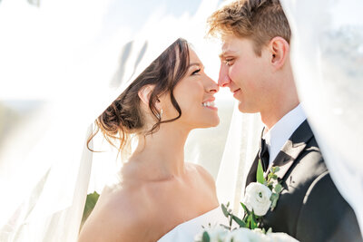 bride and groom looking into each other's eyes