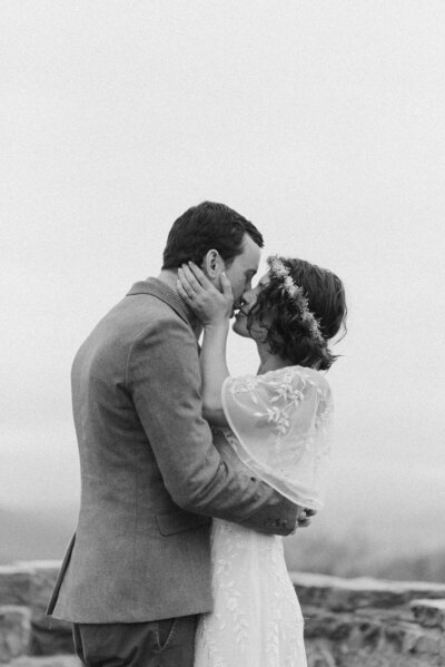 Cinematic portrait of a couple during their mountaintop elopement in Virginia, captured in soft, editorial light with a nostalgic film-inspired aesthetic by Editorial Wedding Co.