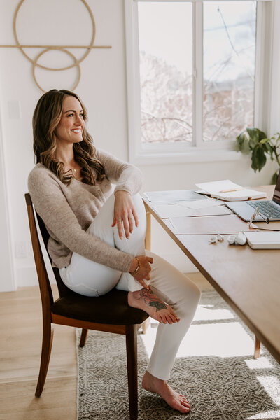 A woman writing a website copy newsletter