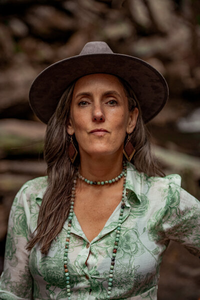 Woman sitting on rocks