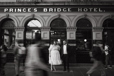 couple standing in front of building