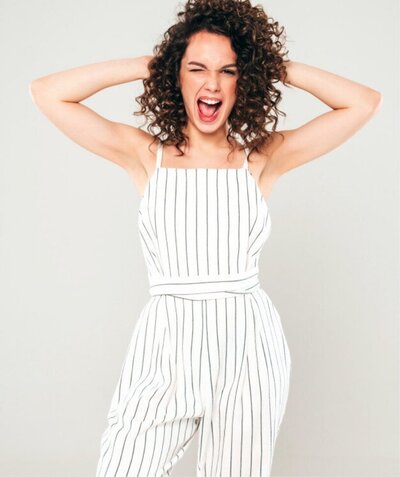 Woman with afro curls looking super confident