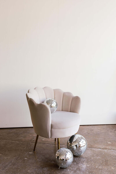 Photoshoot of chair and disco balls