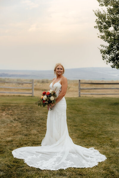 Engagement photo of a couple at sunset in Wyoming, with a romantic outdoor setting and soft natural lighting.