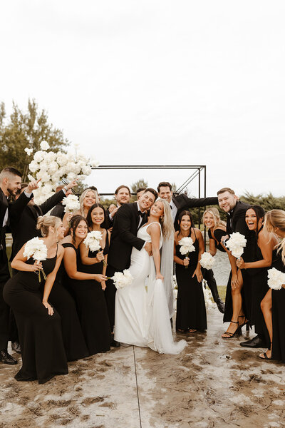 groom kisses bride on head
