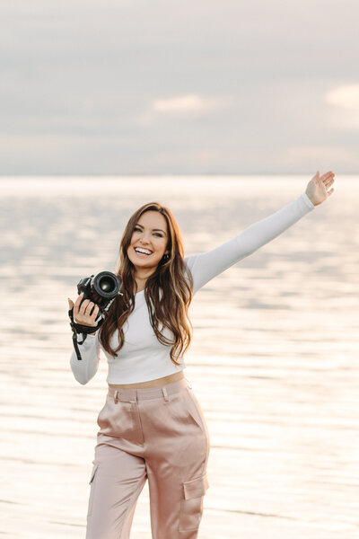 Utah Wedding Photographer captures sand dune bridals with couple celebrating recent wedding ceremony