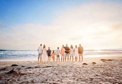 photo of a large family on the beach by La Jolla family photographer Tristan Quigley