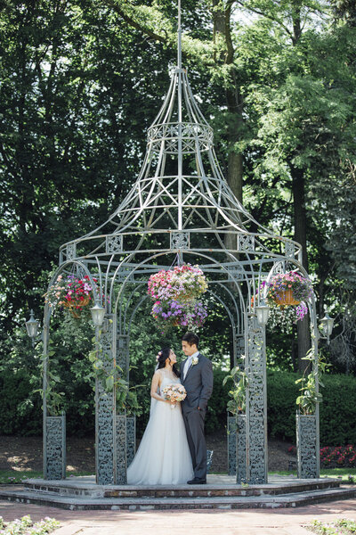 The Grove Wedding | Couple Under Floral Gazebo on a Summer Morning | Cedar Grove, New Jersey