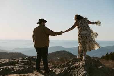 An intimate and cozy moment between a couple during engagement photos in north carolina.